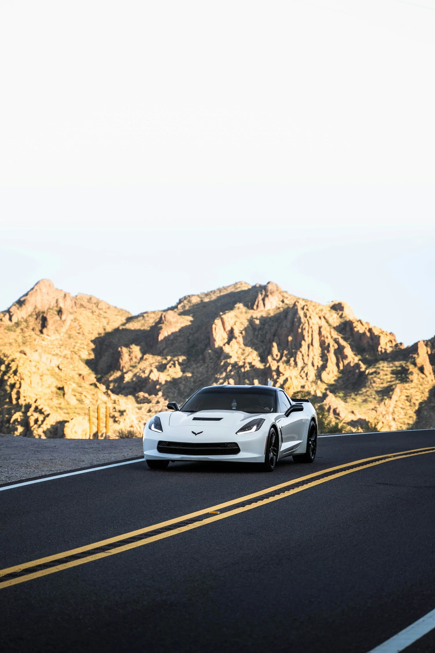 White Corvette on a desert highway
